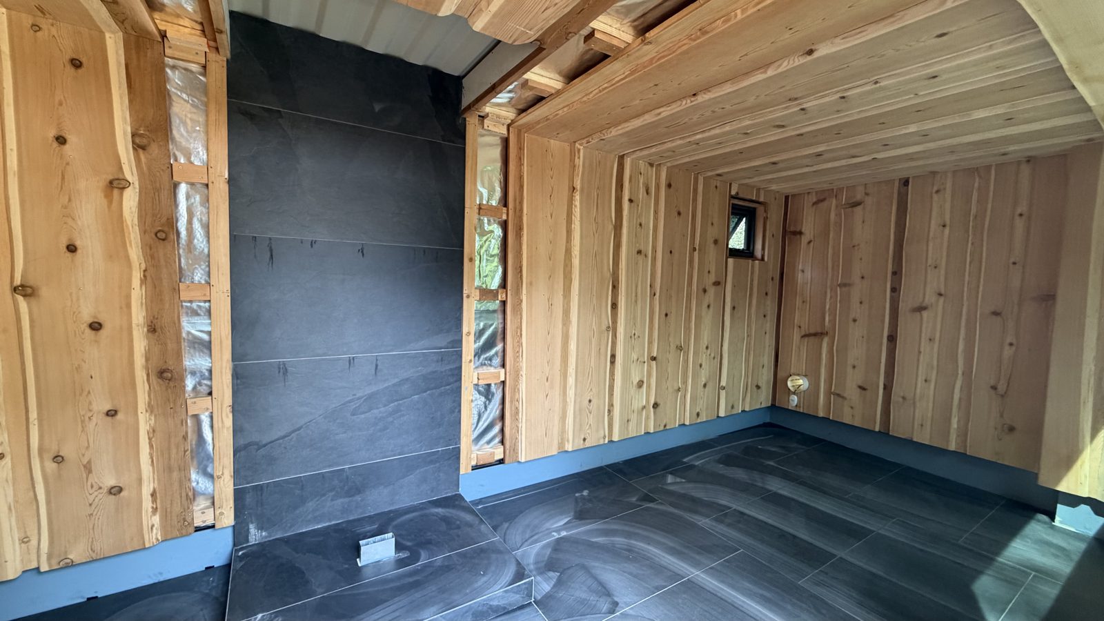 Cedar lining and the slate stove wall
