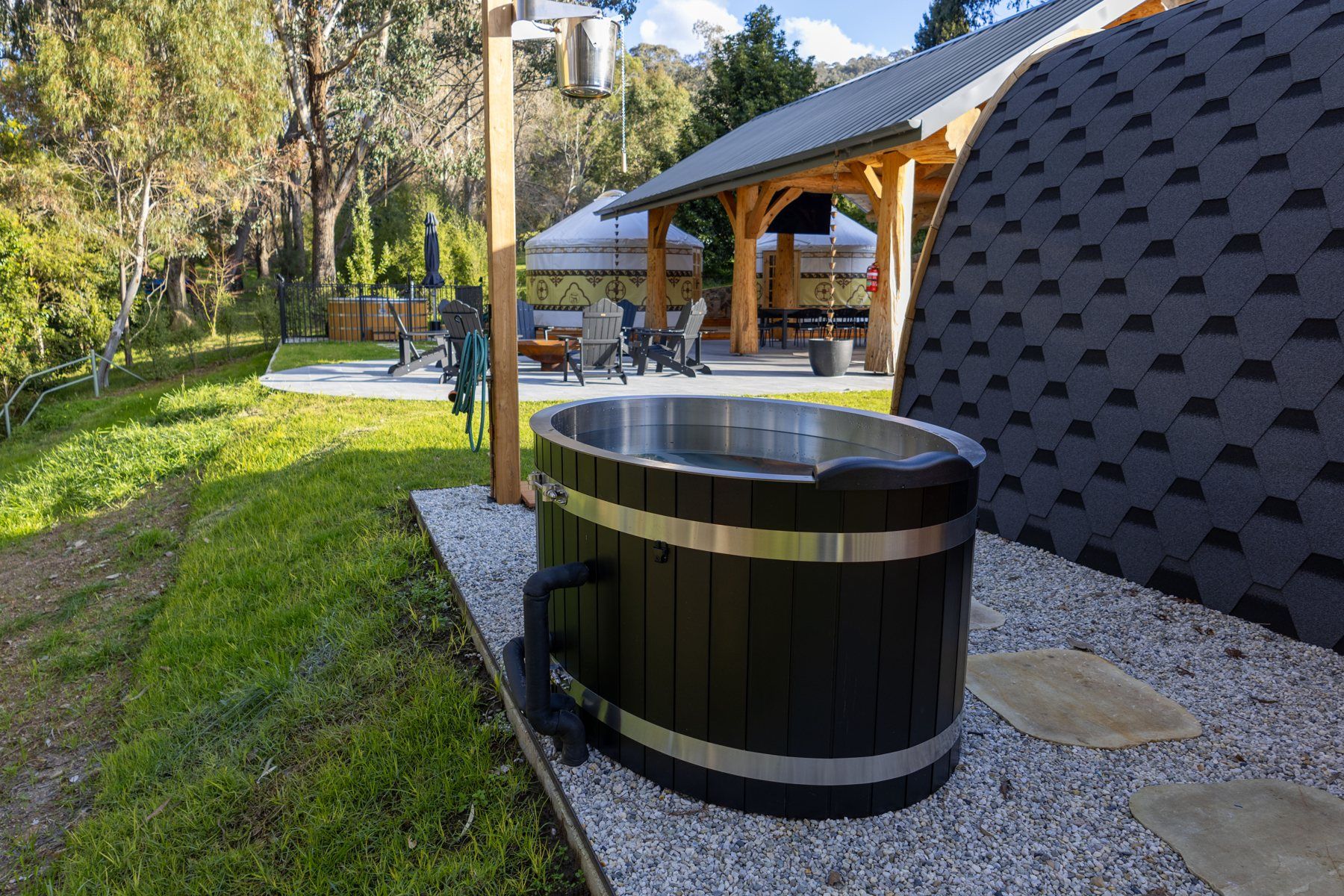 The ice bath outside the private sauna at Bogong Nights, a glamping yurt behind