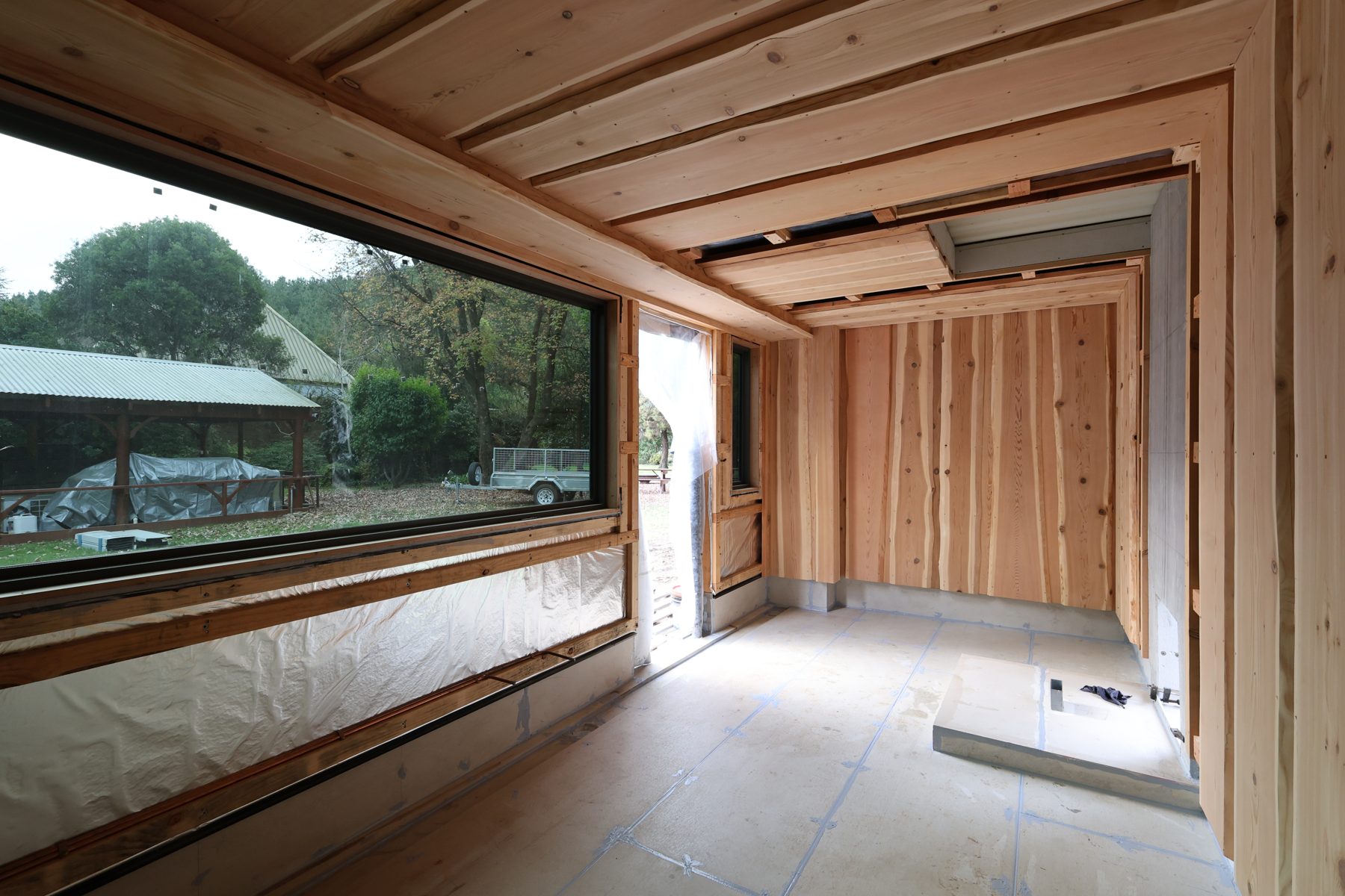Inside the new Bright Banya sauna under construction: cedar walls going up