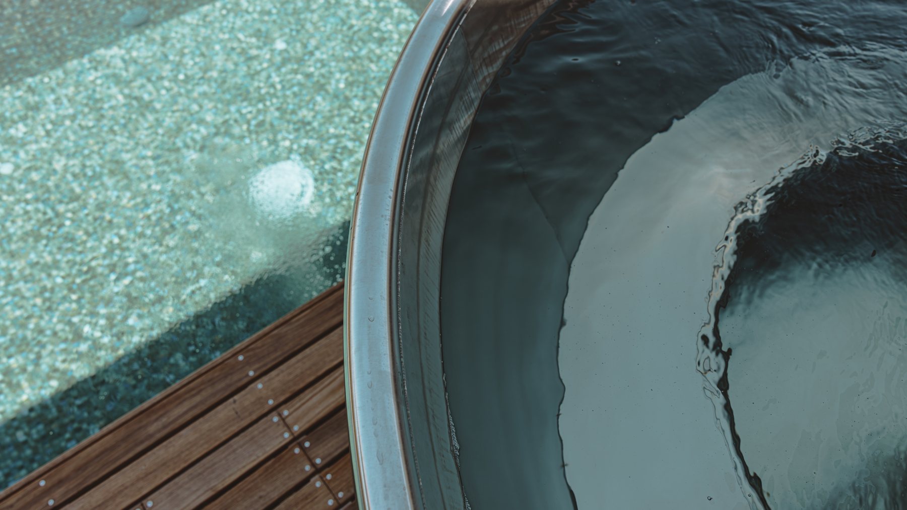 Stainless-steel ice bath beside the infinity pool at the Log Banya sauna, Mount Beauty