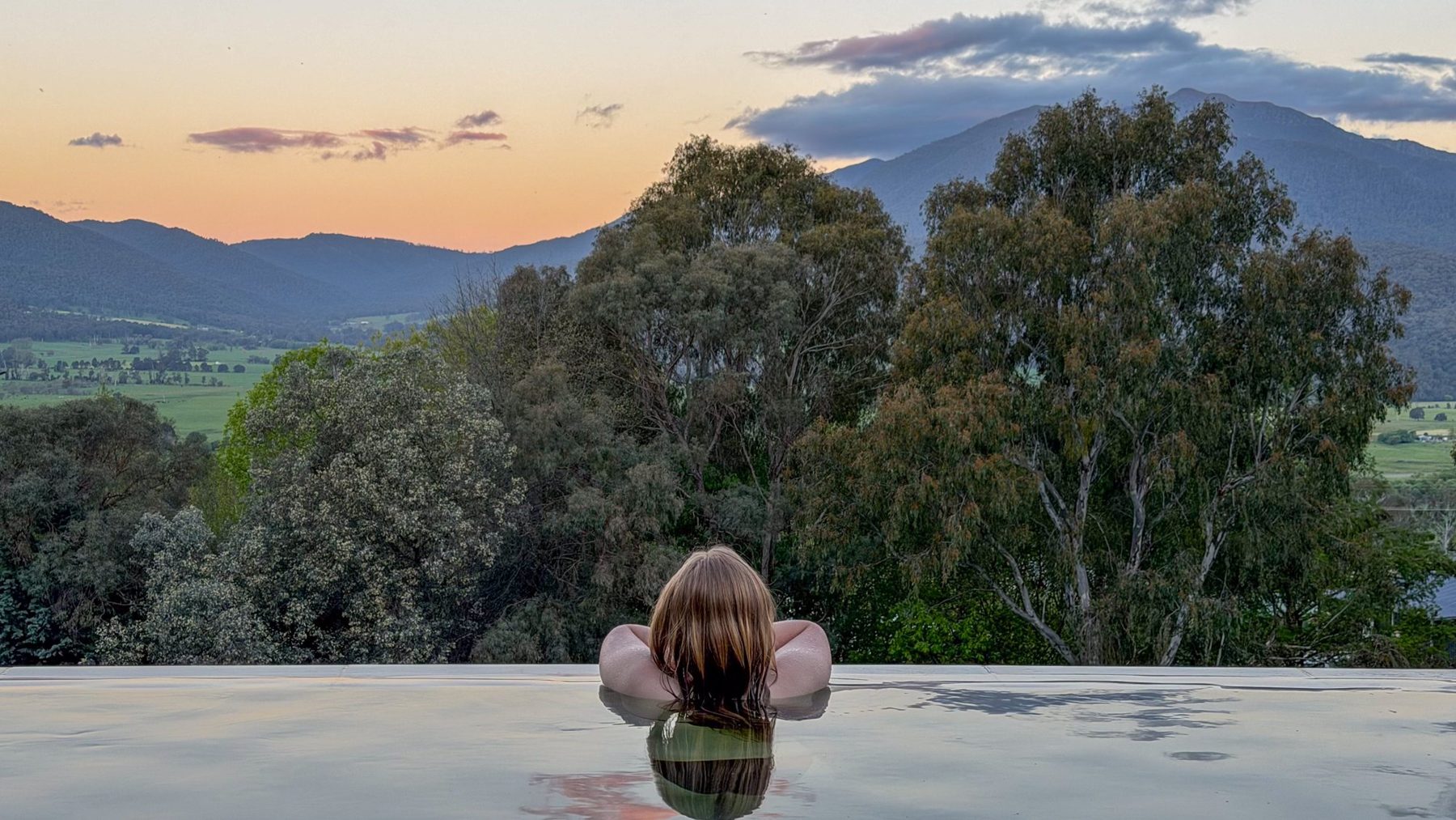 Sunset from the infinity pool on the Log Banya deck, Mount Beauty: the Kiewa Valley and the ranges